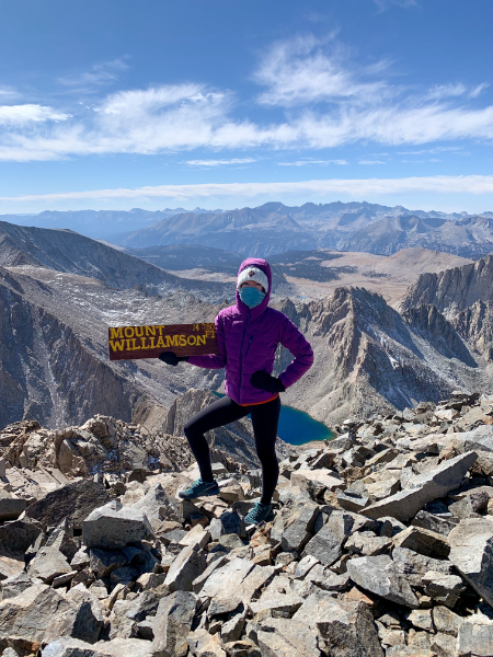 asian girl in purple on mount williamson summit 14er peak