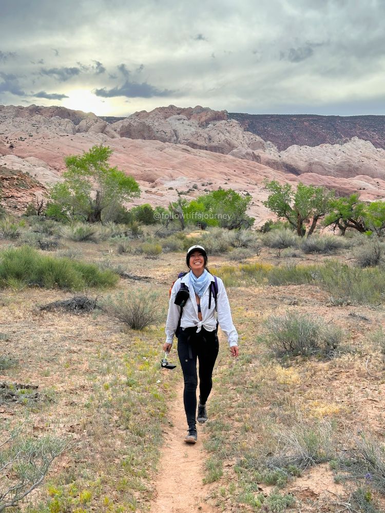 female asian hiker in capitol reef national park 