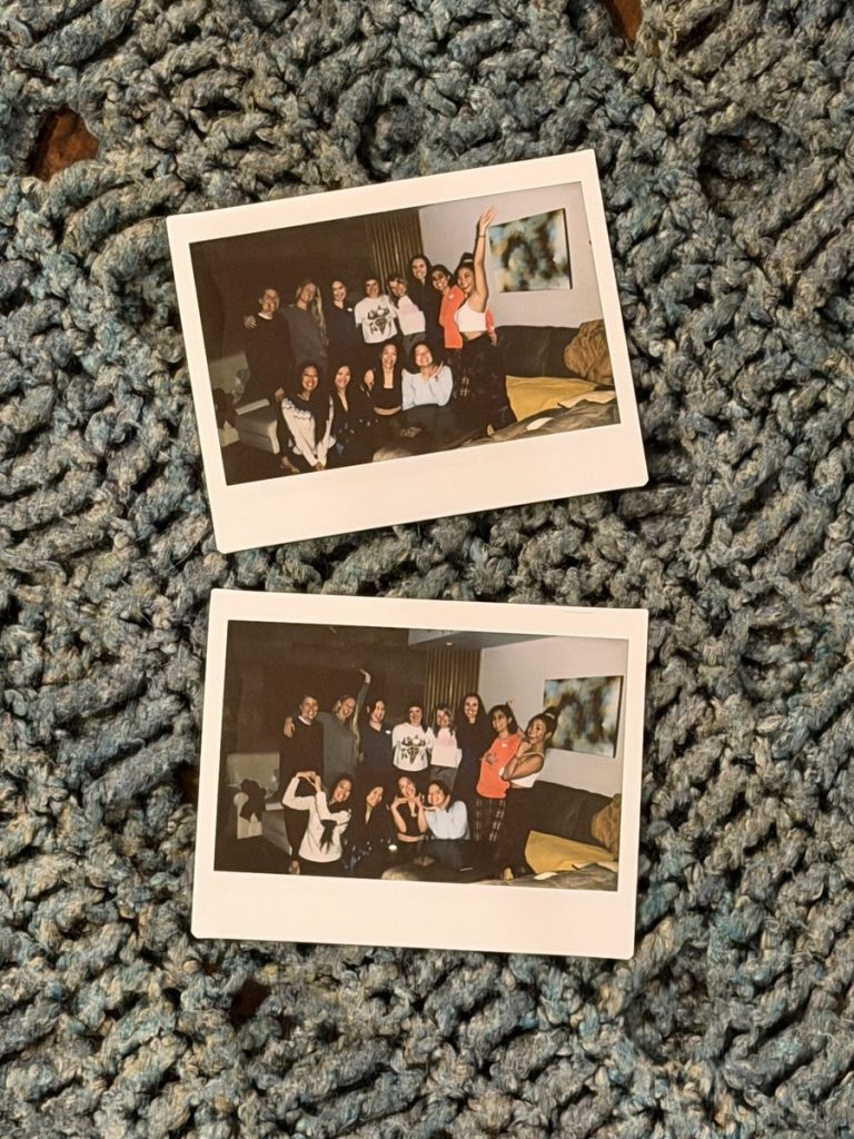 Printed group photos from the 2026 women’s ice climbing retreat